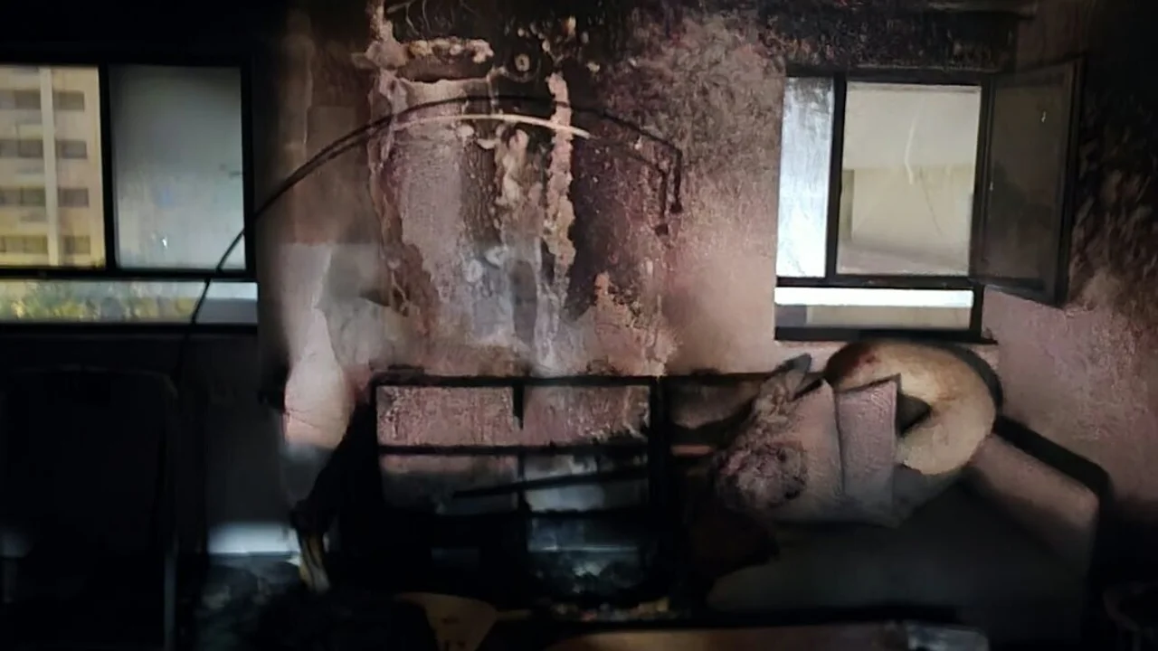 Parents and baby rescued from burning apartment: 'A laptop left charging on the sofa caused the fire'